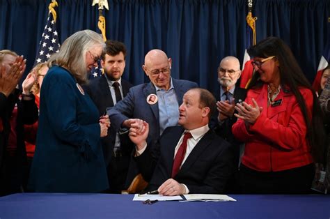 Gun rights advocates promise legal action after Gov. Jared Polis signs 4 gun bills into law
