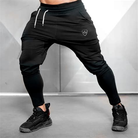 Gym sweatpants. Men's Sweatpants. These sweats are great for the gym or just staying warm during the cold winter months. Available in standard drawstring styles and jogger ... 