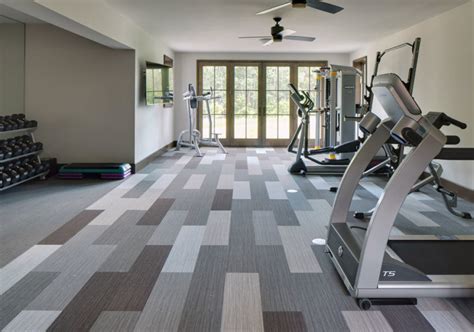 Gymnasium floor tiles. Matéflex is the premier manufacturer of gym flooring solutions. Options include gym floor mats, rubber gym flooring, gym floor tiles, and home gym flooring. 