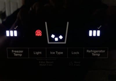 Demonstrating how to turn on refrigerator light on w Whirlp