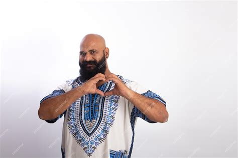 happy Indian Healthy middle aged man wearing cowboy cap making heart ... - balustradellc