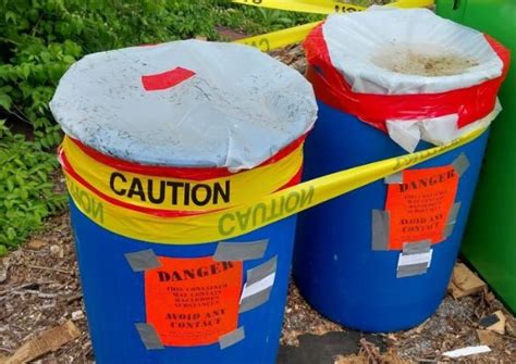 HAZMAT crews investigate two abandoned barrels in St. Louis