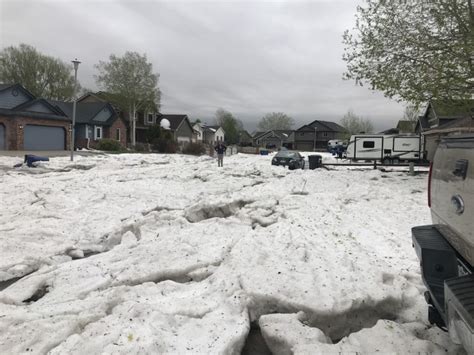 Hail piles up on Johnstown street, damages cars in Erie