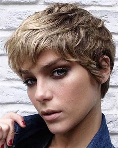 Hair color ideas for pixie haircuts. A short pixie cut with a long fringe gives this style its feminine edge. This is known as a cropped pixie, so your hair is short, but there’s some length to style it. Adding soft waves added to the femininity and some subtle golden highlights for dimension. Shorter cuts will bring you to the salon quicker, every 4-6 weeks, to maintain shape. 