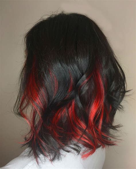 Hair colour black red. Black hair with red highlights is a dark hair color with shades of red streaks painted on the strands. If you’re one of those gals down to spice up your mane, this fits the bill! We have many highlight options that flatter different skin tones and eye colors. 