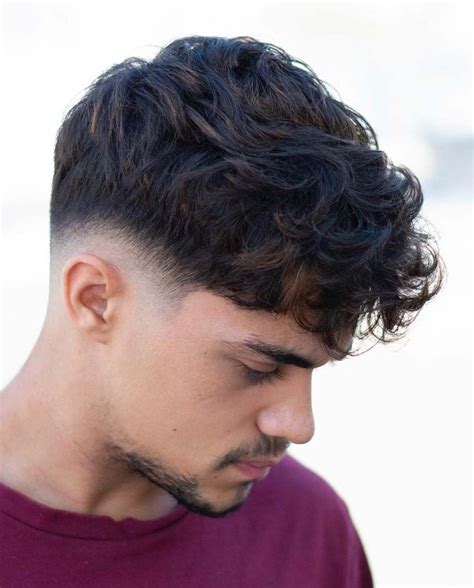 Haircut wavy hair male. 1) Medium Hair Perm. beardoholic.com. Medium-permed hair for men strikes the perfect balance between texture and versatility, offering a confident, stylish look that’s easy to manage and customize to your liking. Discover the charm of well-defined curls and waves that elevate your hairstyle game. 