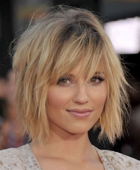 4. Short Wispy Bangs. A sandy blonde nuance is ideal if you want a beautiful natural look. Go for a short bob, create loose waves and spread your wispy bangs on your forehead. Cut them short, one finger above the eyebrows. 5. Black Hair with Short Bangs. Get an impressive look by styling a short straight bob haircut.. 