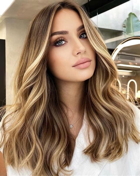 This stunning long hair is the perfect hairstyle to start our gorgeous gallery with! This lady’s hair starts with a muted brown at the roots, blending into a gorgeous golden blonde at the top of the hair, and then blending through to a stunning grey ombre which is so totally on trend and perfect for the Fall season. ... Working from longer at the …