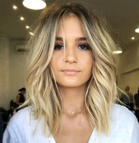 Three-tier Layered. If you have a beautiful long head of blonde hair and you don’t want to do anything too extreme to it because you enjoy the length, this three-tier layered haircut with blonde is the right option for you. It adds a bit of texture without compromising any length. 11. Layered Pixie.. Hairstyles blonde and brown