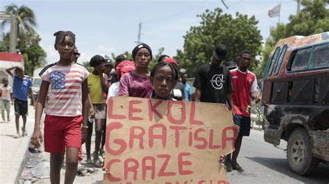 Haitians, weary of gang violence, protest the kidnapping of an American nurse and her daughter