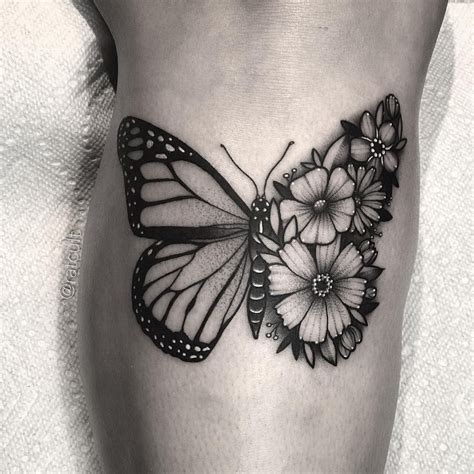 Beauty and Femininity. The half butterfly half flower tattoo design i
