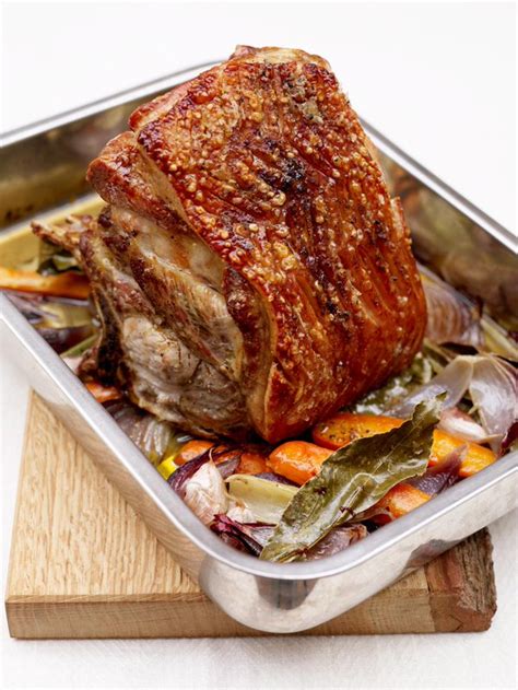 Half shoulder of pork. Massage and press into meat as best possible. Place meat in a large zip-top bag, sealed, overnight to marinate. Preheat oven to 350° (F). Place seasoned pork but on wire rack of a roasting pan with the fat side up. Place in oven at 350° (F) approximately 3-4 hours. Monitor closely with an instant read meat thermometer. 