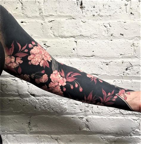Try a Temporary Tattoo. This unique half sleeve tattoo design is in a rich blend of florals, leaves, music notes, foliage, archaic moon crescent, and other symbols. The elements are drawn using coloured ink in the careful and vibrant shades of black. You can get this design customized further according to your preference and taste.. 