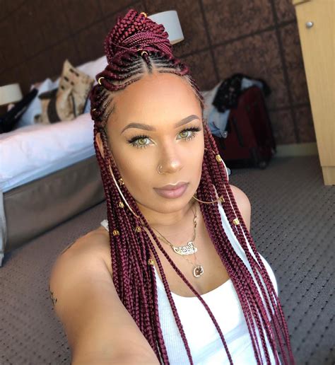 Long knotless braids with curly ends are a popular, low-ma