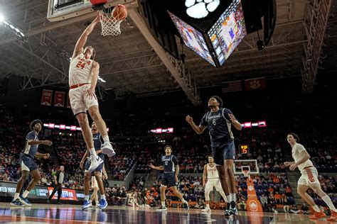 Hall scores 27 to lead No. 18 Clemson to 109-79 rout of Queens