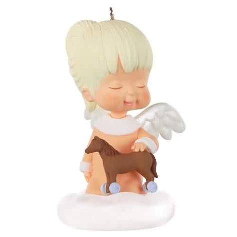 Enter into the magical world of 2023 Hallmark Keepsake Christmas Ornaments! Mary's Angels Sunflower. Continue your adoration of Mary's Angels Christmas tree ornaments with Sunflower. Ready to celebrate a season of heavenly harmony, this celestial cutie happily holds a bluebird as she stands on a glistening cloud.. 