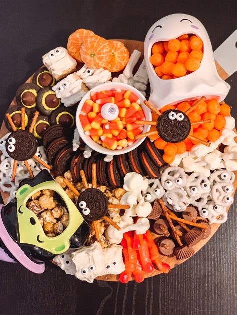 Halloween snacks. Aug 10, 2023 · Grab a container of cannoli cream and turn it into the easiest Halloween dessert in a snap. Layer in a baking dish with crushed chocolate wafer cookies on top and use cannoli chips as the ... 
