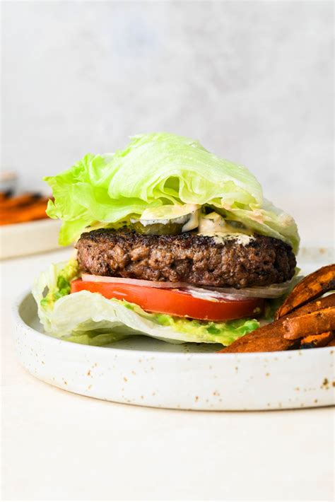 Hamburger lettuce. Preheat the grill to high heat. Clean and lightly baste the grill grates with oil. Form beef mixture into 8 (5-inch) flat patties. Place patties on the preheated grill and immediately turn the heat down to medium. Cook for 4 minutes on each side. 