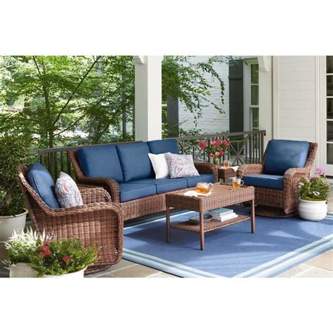 The Hampton Bay Cambridge 5-Piece Brown Wicker Outdoor Patio Conversation Seating Set with CushionGuard Chili Red Cushions is a comfortable set. Instructions were easy to follow and assembly was a breeze. The cushion covers come off for washing. We like being able to store the ottomans under the seats..