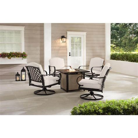 Hampton bay laurel oaks 7 piece black steel outdoor patio dining set with standard putty tan cushions 000 the home depot furniture decor 525 0200 cushionguard stone gray h105 01424900 002 included choose your own color brickseek midnight navy blue 01411400 dark brown table beacon park wicker stationary lounge chair toffee trellis .... 