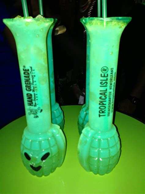 The hand grenade is unique first and foremost by how it is served - in a translucent green plastic container with a grenade bulb base and a shaft for your hand to hold onto. A straw is provided, which speeds up a drinking process that honestly should probably be slowed down. A bartender mixes up a few refreshing hand grenades — …. 