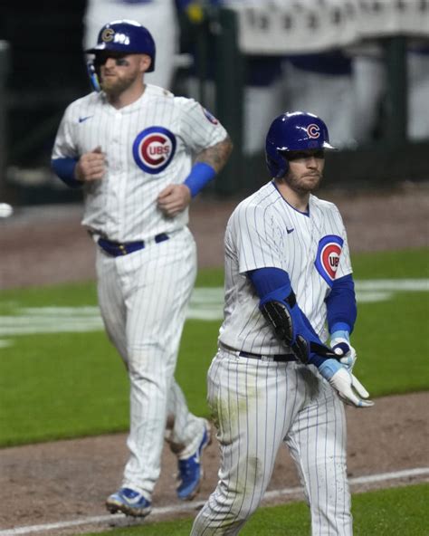 Happ’s 4 RBIs lead Cubs over Pirates 11-3 after rain delay