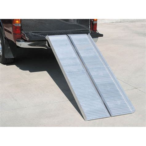 This motorcycle carrier rack with ramp is built from rugged aluminum to accommodate up to 400 lb.. The platform easily adjusts to any bike size. Features include a drop-down tire design with a clamp-on device for the front wheel for additional security. Drop-down tire design plus clamp-on device on front wheel for added security