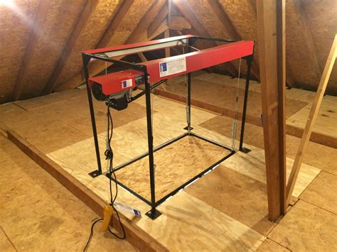 The motor cost $100.00 from Harbor Freight it is a 400 LB hoist item 40765. The garage hardware cost $90.00. The frame I had a welding shop make, and that co... Daphne Stevens. ... Versa Lift Attic Lifts can organize your garage clutter and add valuable space in your attic using the attic lift system to safely put stuff upstairs. Climbing up .... 