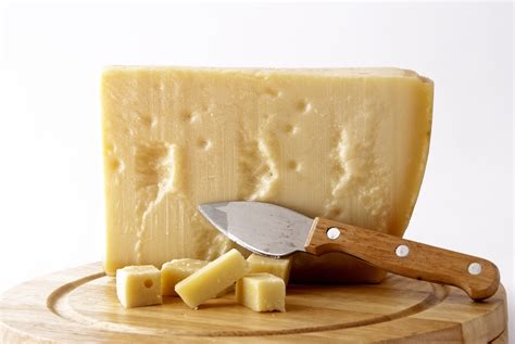 Hard cheese. Emmental cheese is a hard, unpasteurized cheese made from cow’s milk. It is well-known for its distinctive large holes or “eyes”, and its mild, slightly nutty, and fruity flavor. Swiss immigrants brought the traditional Emmental cheese recipe to America in the mid-1800s and started small cheese production. 