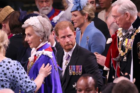 Harry’s brief awkward look as he sits several rows back from William and Kate at Charles’ coronation