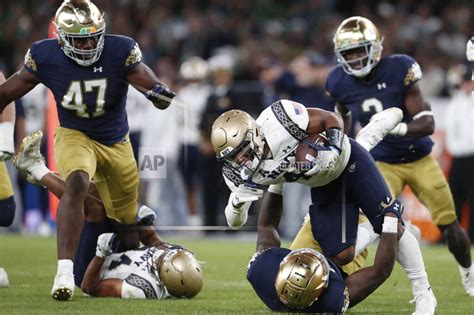 Hartman throws 4 TD passes as No. 13 Notre Dame opens with a 42-3 win over Navy in Ireland