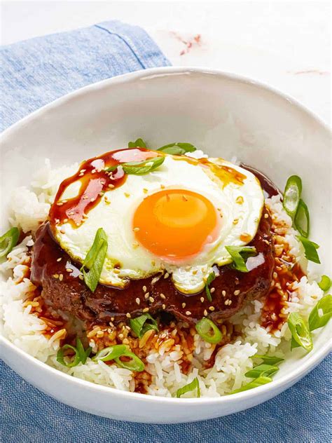 Hawaiian loco moco. First, in a medium to large sized skillet, add 4-6 slices of Spam® on medium/high heat. Then, sear the on both sides until browned and crispy. Remove from heat, set aside until later use. In the same skillet used to sear Spam®, add garlic, onion and mushrooms and sauté. If needed, add a small amount of oil (one tsp). 