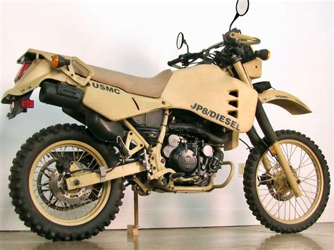 Hdt m1030-m1. The KLR650 is powered by a 652cc single-cylinder engine with a built in 5-speed gearbox. It has a chain drive to the rear wheel, a generously proportioned fuel tank, and standard telescopic forks up front with a monoshock rear end. The JP-8/diesel version of the KLR650 was developed by Fred Hayes, chief executive of Hayes Diversified ... 