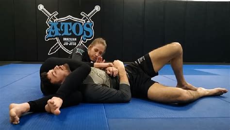 Headscisor - Alina shows off her superb leg strength by locking up Mike in a suffocating headscissor hold. That's one strong girl, and the smug expression on her face as she smoothly crushes the life out of her victim is priceless! 