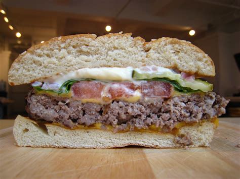Healthiest fast food hamburger. The patties are made from all-natural ground chicken breast and seasoned with a signature spice blend. The white meat chicken makes this burger perfect for anyone who’s trying to avoid trans fats like those found in beef fat. The burger is topped with swiss cheese, lettuce, tomato, and all-natural mayo. 12. 