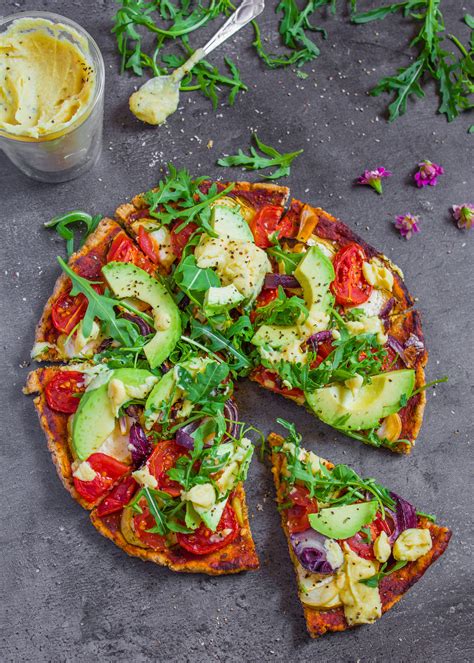 Healthiest pizza. Better choices. The Saviour is advertised as ‘NZ’s healthiest pizza’. Two slices of a double size (204g) will give you 1510kJ, 6g sat fat and 661mg sodium. The sprouted seed base and heaps of veges give a filling 9.4g of fibre. Sinister (vegan), two slices (1306kJ, 0.6g sat fat, 614mg sodium) 