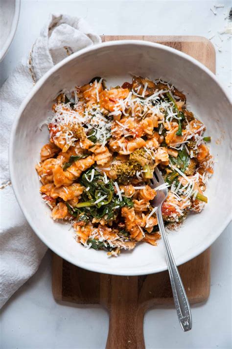 Healthy pasta. Add the Parmesan to the skillet and stir until it is melted into the sauce. Add the fresh spinach to the skillet and gently stir it into the sauce until it has wilted (2-3 minutes). Add the pasta and stir until it is well coated in the creamy tomato sauce. Taste and adjust the salt and pepper as needed. Serve warm. 