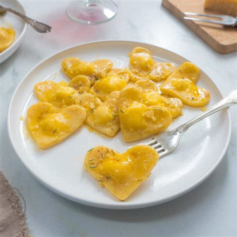 Heart shaped ravioli. Plus, it pairs well with any ravioli, from cheese and mushroom to beef and lobster. Go to Recipe. 5. White Wine Cream Sauce. White wine cream sauce is another good option for those who like lighter, brighter sauces. The sauce itself is thick and creamy, but its flavor is anything but heavy. 
