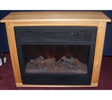 Heat surge adl 2000m x. Remove front lower cover on front of fireplace below logs. Two screws must be removed. Flame tube might be visible on left side. Grab left end of flame tube and push upward until shaft of tube is inserted into hole that is located in the center of the bracket. Replace lower front cover. Plug fireplace into electrical outlet. Turn fireplace on. 