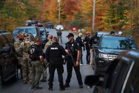 Heavily armed police surround home in search for suspect in the deadly Maine shootings