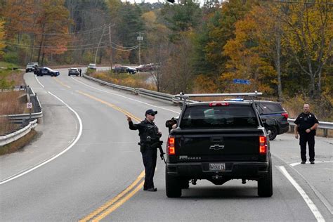 Heavily armed police surround home in search for suspect in the fatal shooting of 18 in Maine