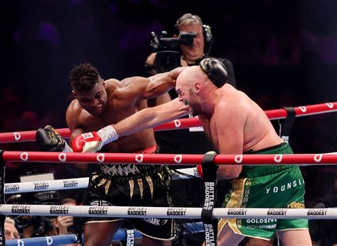 Heavyweight boxing champ Fury survives scare from former UFC fighter Ngannou to win split decision