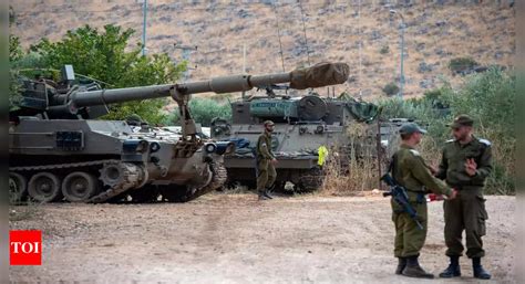 Hezbollah and Israel exchange fire as Israeli soldiers battle Hamas the day after a surprise attack