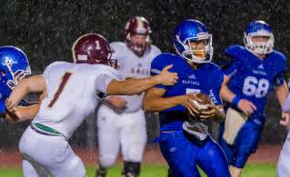 High school football: In the rain, Centennial unleashes passing game and clinches Metro-North title