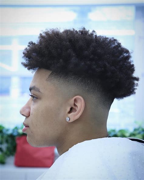 Then taper the hair below the curve and gradually fade it to make a trendy and delightful look. #18 - High Front with a Tapered Slope. Source: Instagram@barber_mworia. ... Black men can style low taper fades, and high taper fades with thick hair, straight hair, full locks, .... 