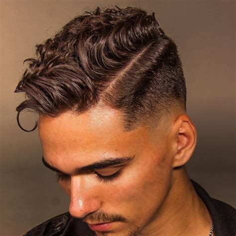 High taper fade wavy hair. A taper fade haircut on the sides and back provides a high-contrast style that focuses the eyes on the waves hairstyle on top. There are many different fade … 