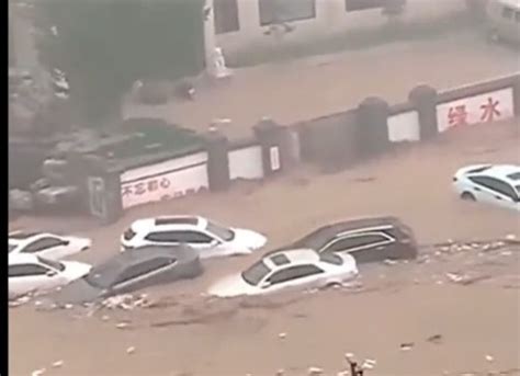 High water sweeps fire truck into a river, leaving 5 missing, as tropical storm hits China