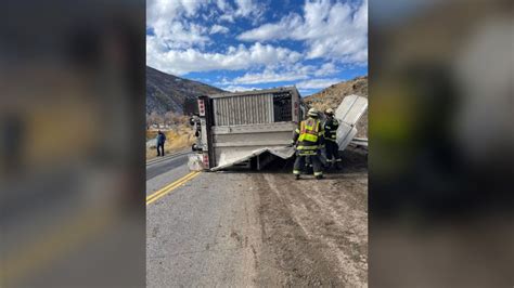 Highway closed after semi hauling cattle rolls over