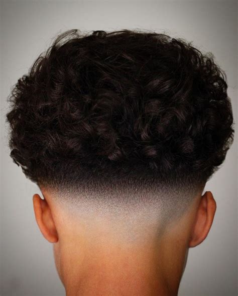 Hispanic fades with curly hair. Loose Waves Perm. Perm hairstyles for men may be tight or loose. If you want a cool and sleek look, you can go for a loose wave. This hairstyle is a mix of curly and wavy styles. Also, it works well with fade variations such as skin fade. When it comes to a hairstyle like this, maintenance and management will be a bit of a hassle. 