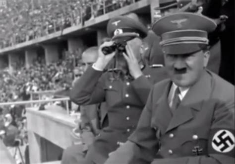 Hitler tweaking at olympics. August 1936. The last of 3,000 runners who carried the Olympic torch from Olympia, Greece, arrives in the Lustgarten in Berlin to light the Olympic Flame and start the 11th Summer Olympic Games. For two weeks in August 1936, Adolf Hitler's Nazi dictatorship camouflaged its racist, militaristic character while hosting the Summer Olympics. 